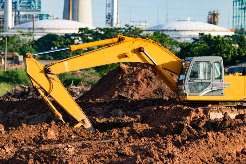 Excavators are assignments and refinery background