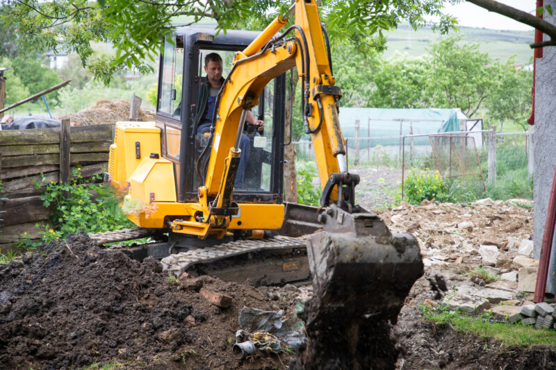 excavator with Bucket lift up are digging the soil in the construction site on